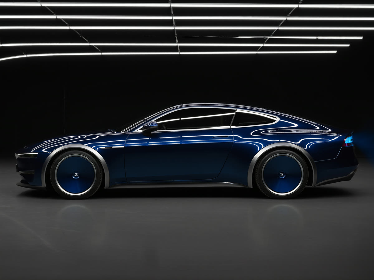 Gleaming dark sedan in a detailing studio